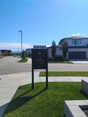AVAILABLE rider over a listing panel on a black post frame at a corner lot