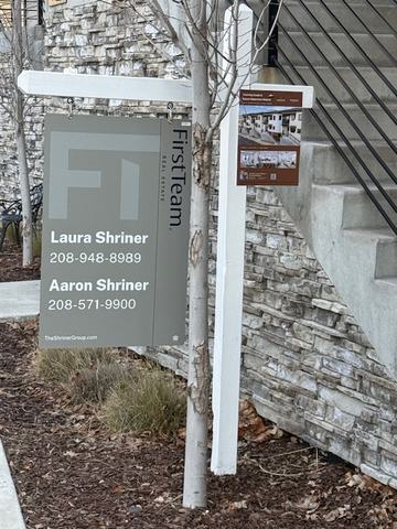First Team listing panel with brochure box on a white post