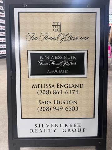 Fine Homes of Boise panel in a black A frame